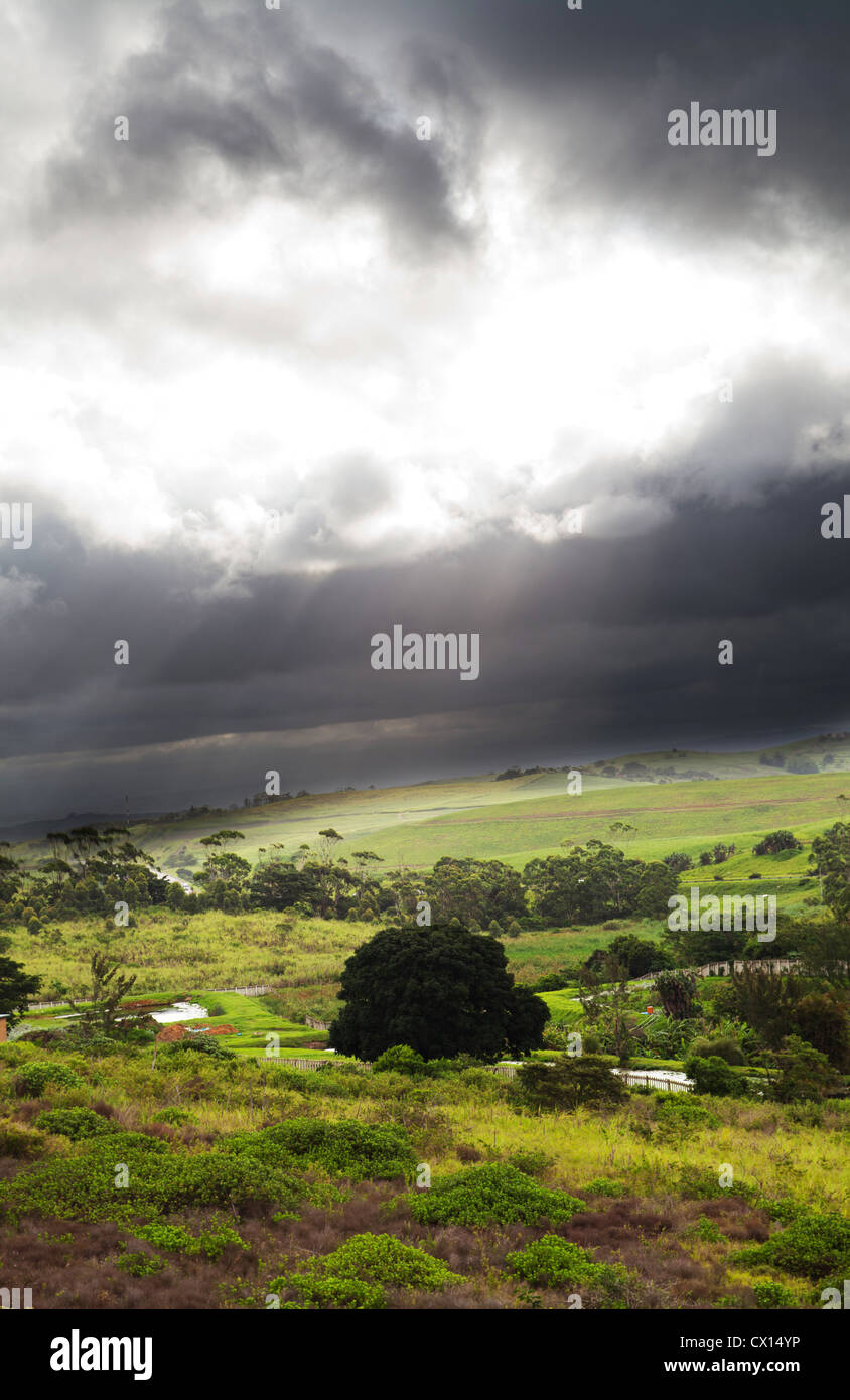 sunlight through black clouds before storm arrives Stock Photo