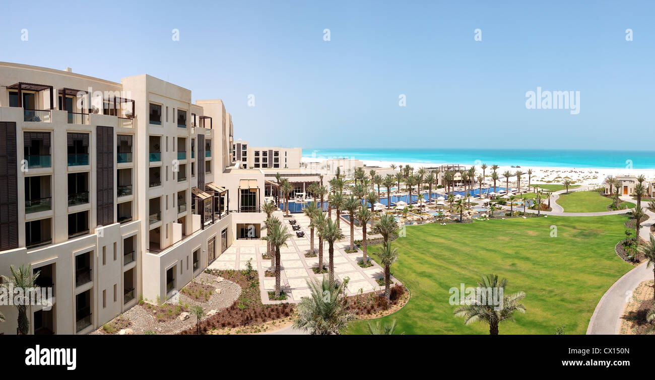 Panorama of swimming pools and beach at the luxury hotel, Saadiyat island, Abu Dhabi, UAE Stock Photo