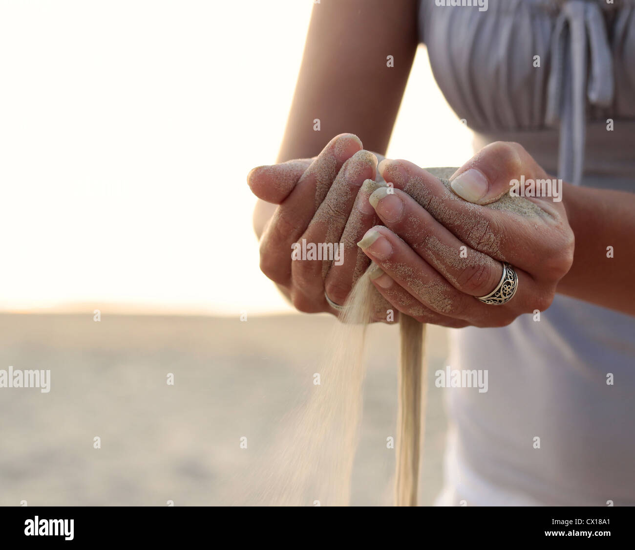 Time as the sand slips through your fingers Stock Photo: 50430297 ...