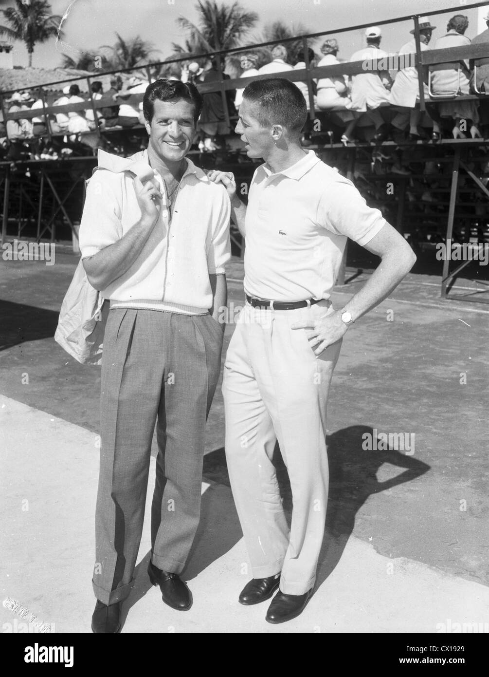 Hugh (Wyatt Earp) O'Brien and tennis pro Tony Trabert in Palm Beach, Florida, ca 1955 Stock Photo