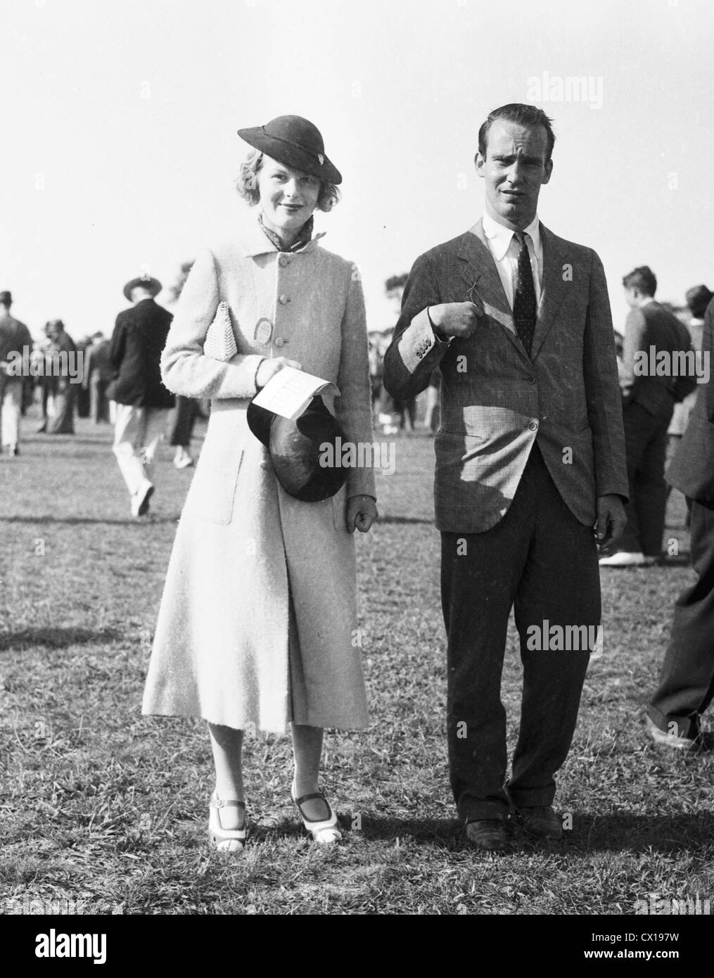 Mr & Mrs August Belmont Jr arrive at the Southampton Riding and Hunt Club steeplechase in Southampton, L.I. ca 1935 Stock Photo