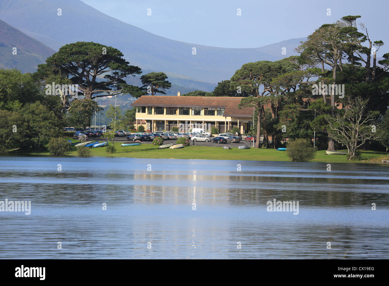 co county kerry, parkland golf course club house on an irish lakeside with irelands highest mountain range in background Stock Photo