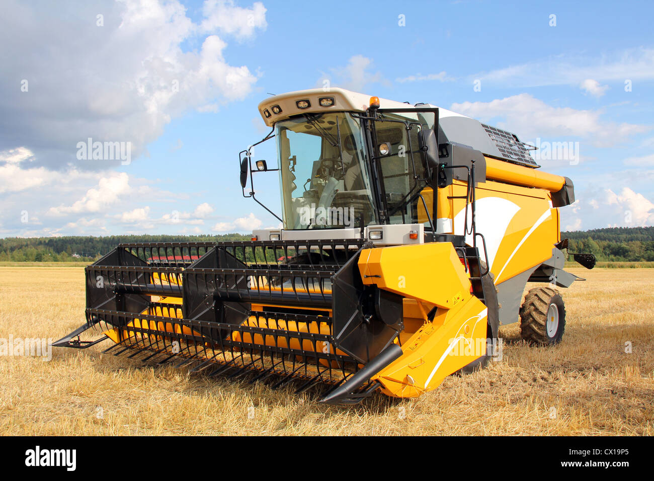Modern Combine Harvester on Field Stock Photo