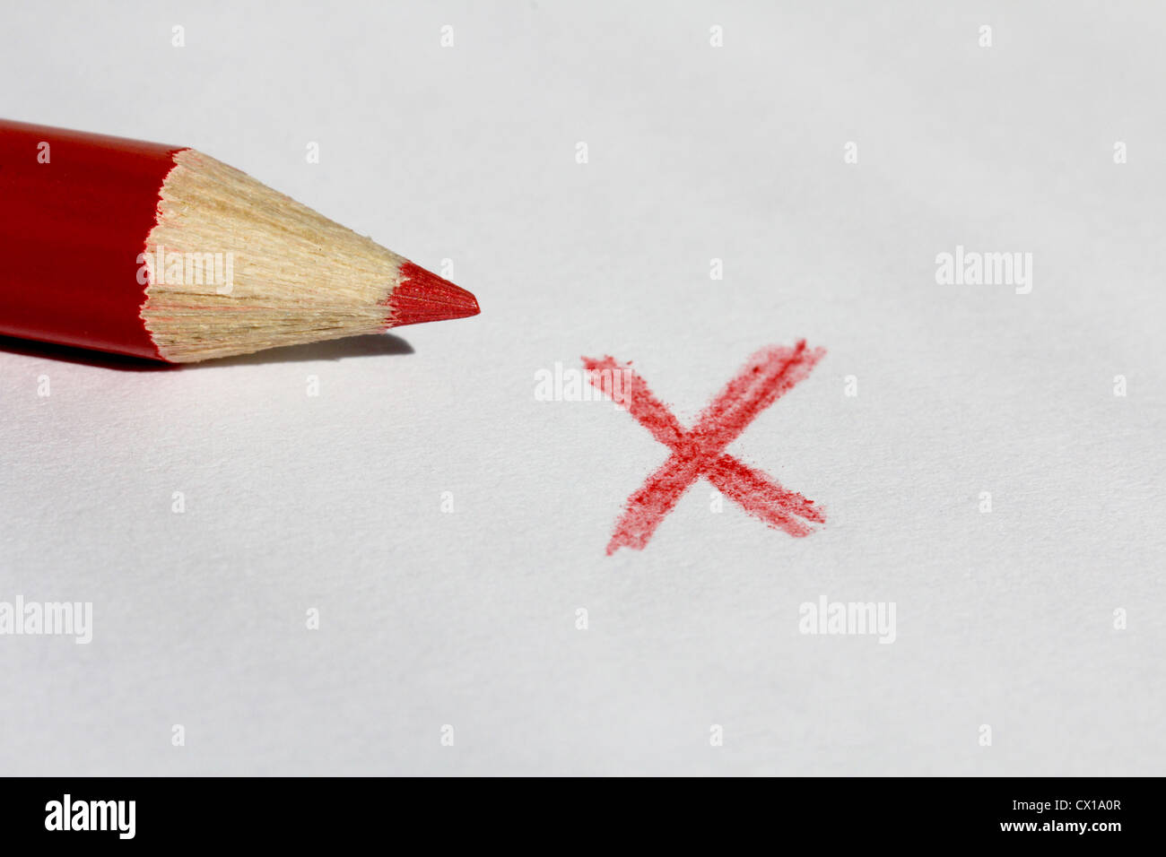 Red Color Pencil and X Mark Stock Photo
