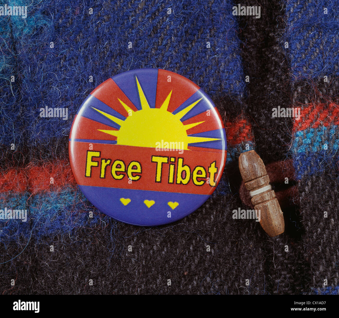 A 'Free Tibet' badge on a Tibetan coat. Stock Photo