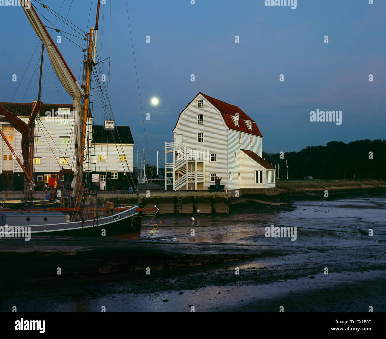Dusk view of full moon over Woodbridge tide mill, by the River Deben, Suffolk. (Or, tide's out at the tide mill...) Stock Photo