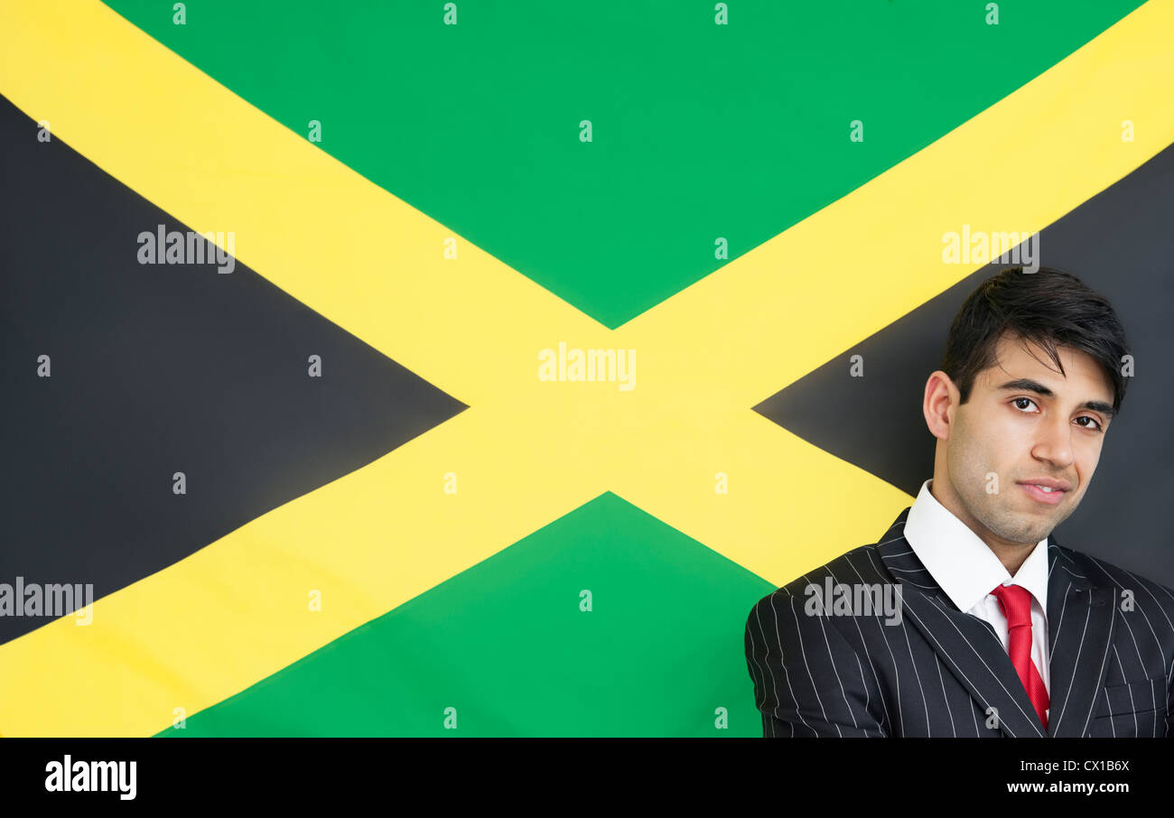 Portrait of a confident businessman against Jamaican flag Stock Photo