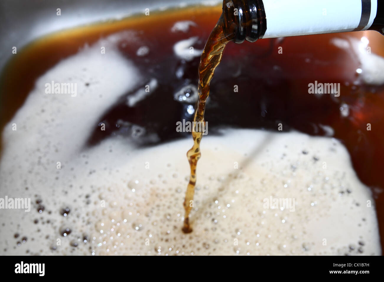 Beer being poured down the sink Stock Photo Alamy
