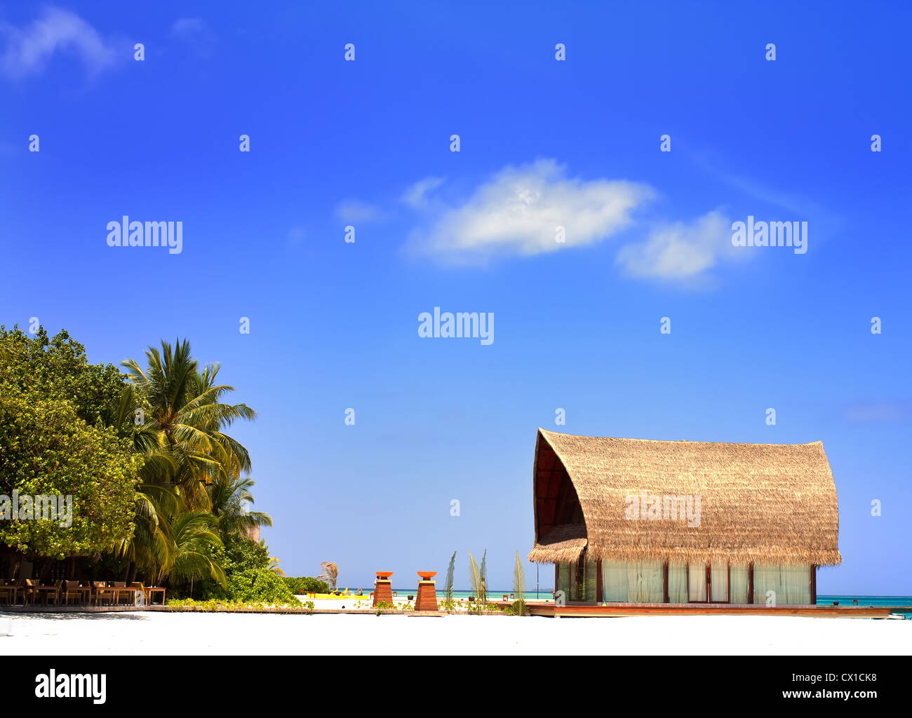 Landscape photo of Beachfront villa with clear blue sky in Maldive  Stock Photo