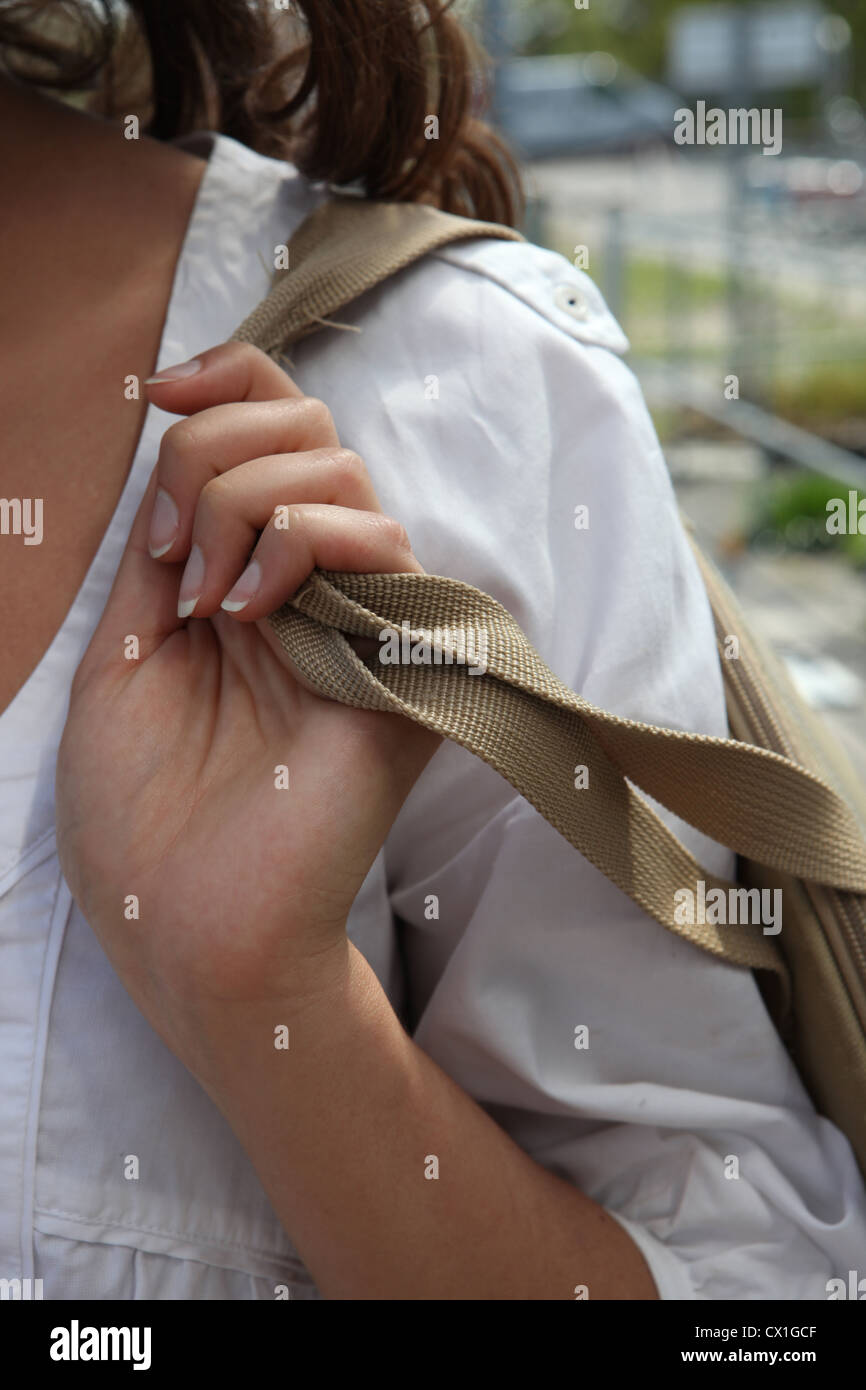 Woman carrying a bag over her shoulder Stock Photo Alamy