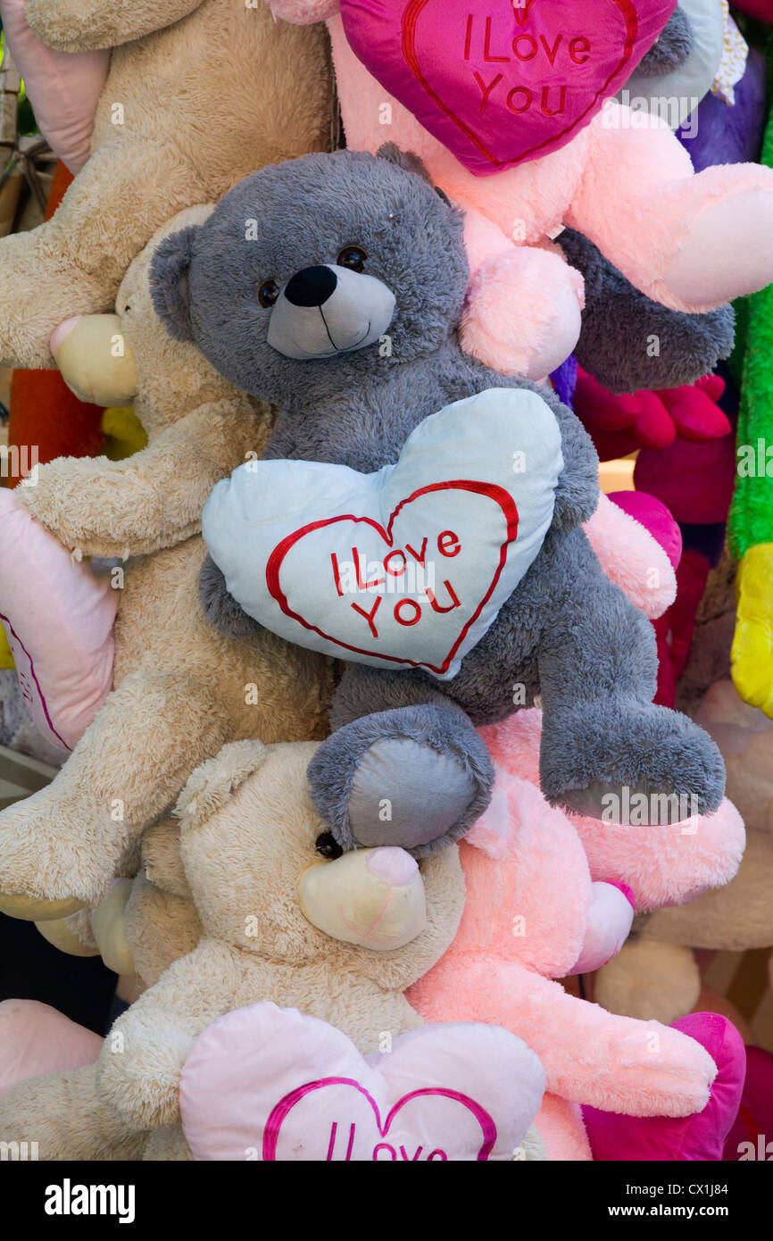 Teddy bear holding a heart saying 'I Love You' Stock Photo