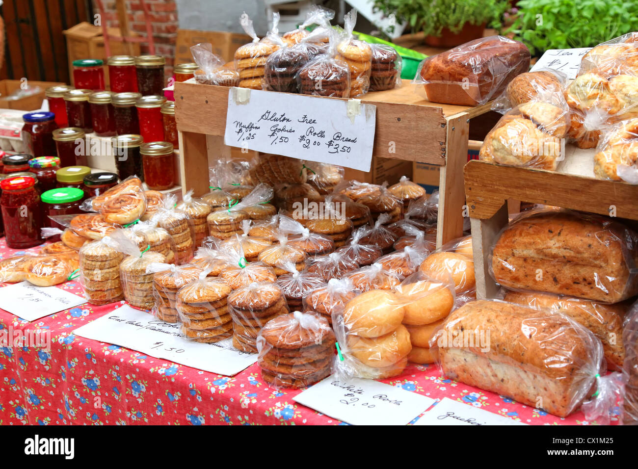 Baked goods and homemade preserves and jams at a farmer's market. Stock Photo