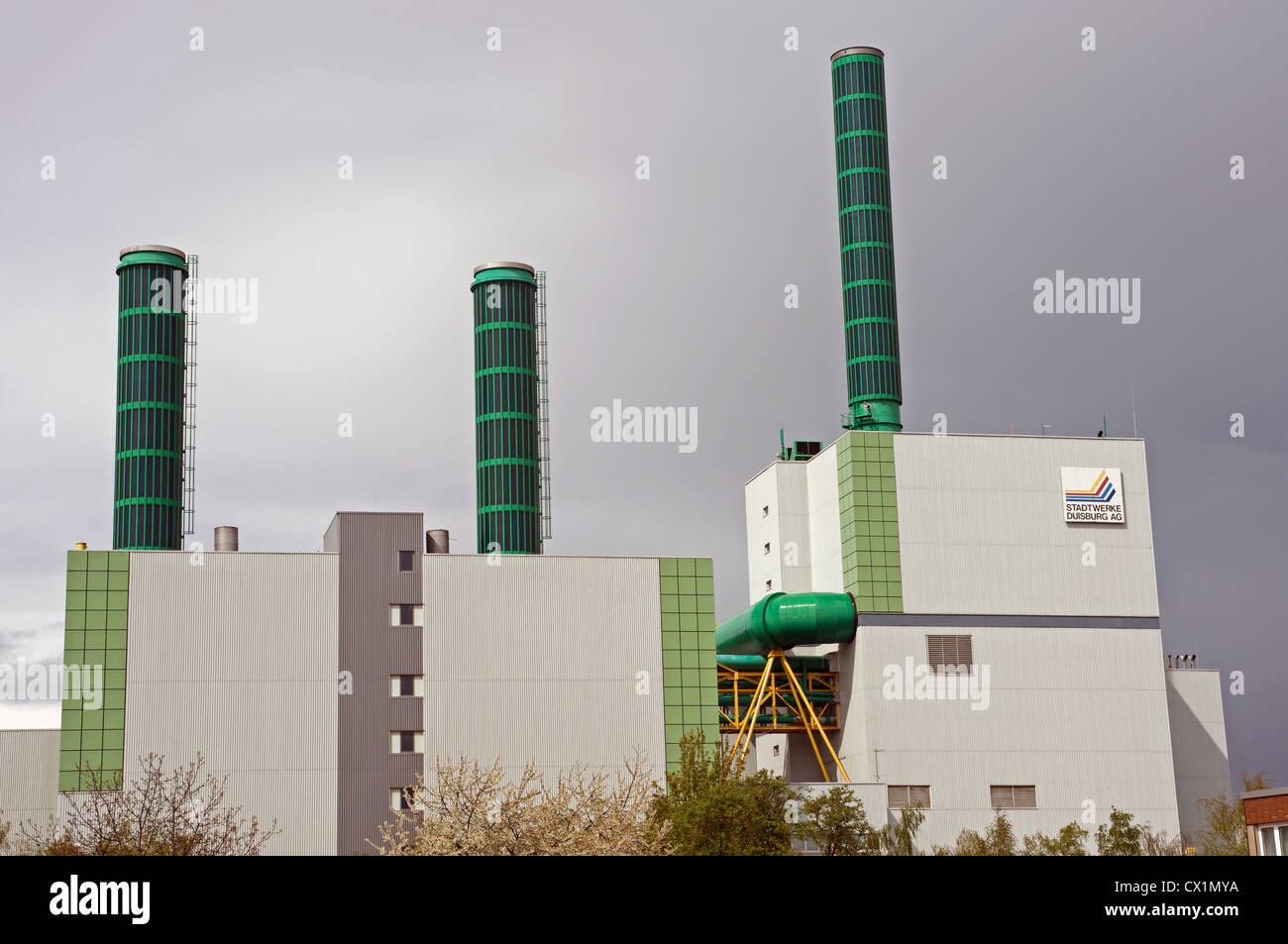State-of-art gas-fired power station with solar energy panels fitted to the chimneys Stock Photo