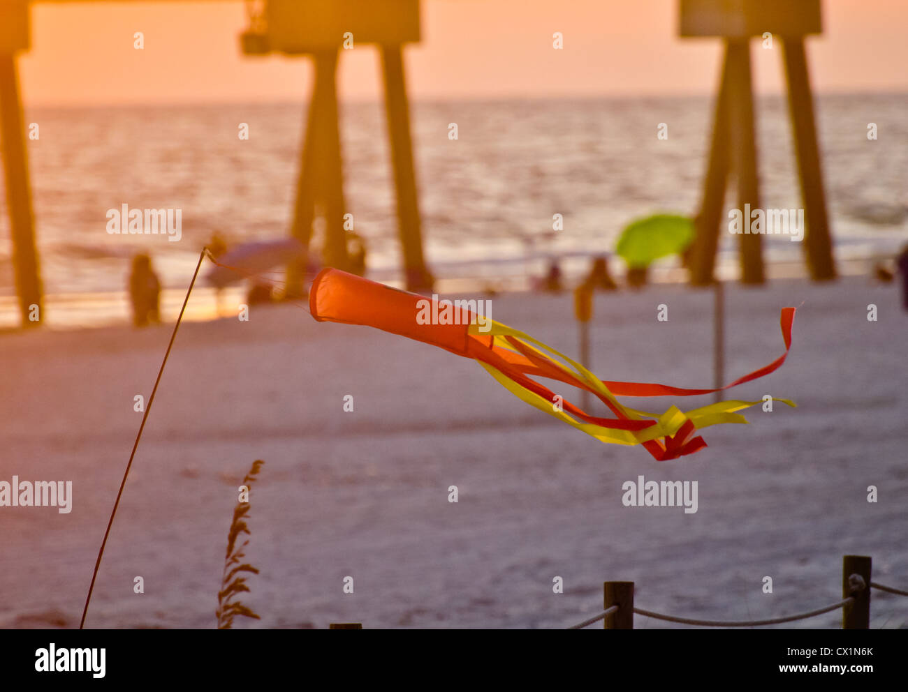 windchime on a beach scene at sunset Stock Photo