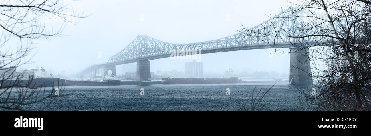 Montreal Jacques Cartier cantilever bridge during the Winter.  The Saint Lawrence River is not Frozen Stock Photo