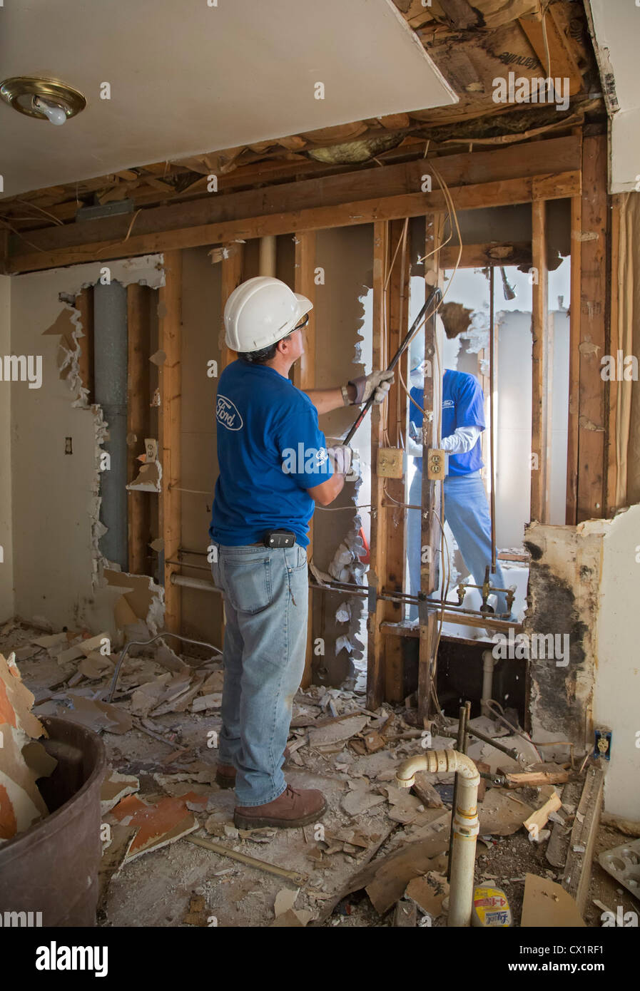 Ypsilanti, Michigan - Volunteers from Ford Motor Co. renovate a foreclosed house for Habitat for Humanity. Stock Photo