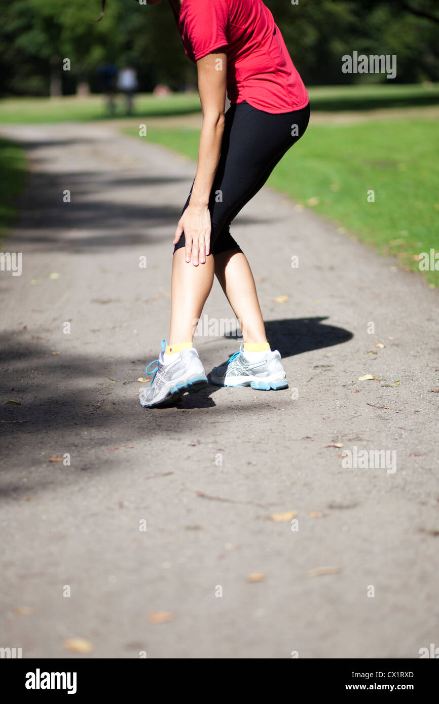 woman having cramp while running Stock Photo Alamy