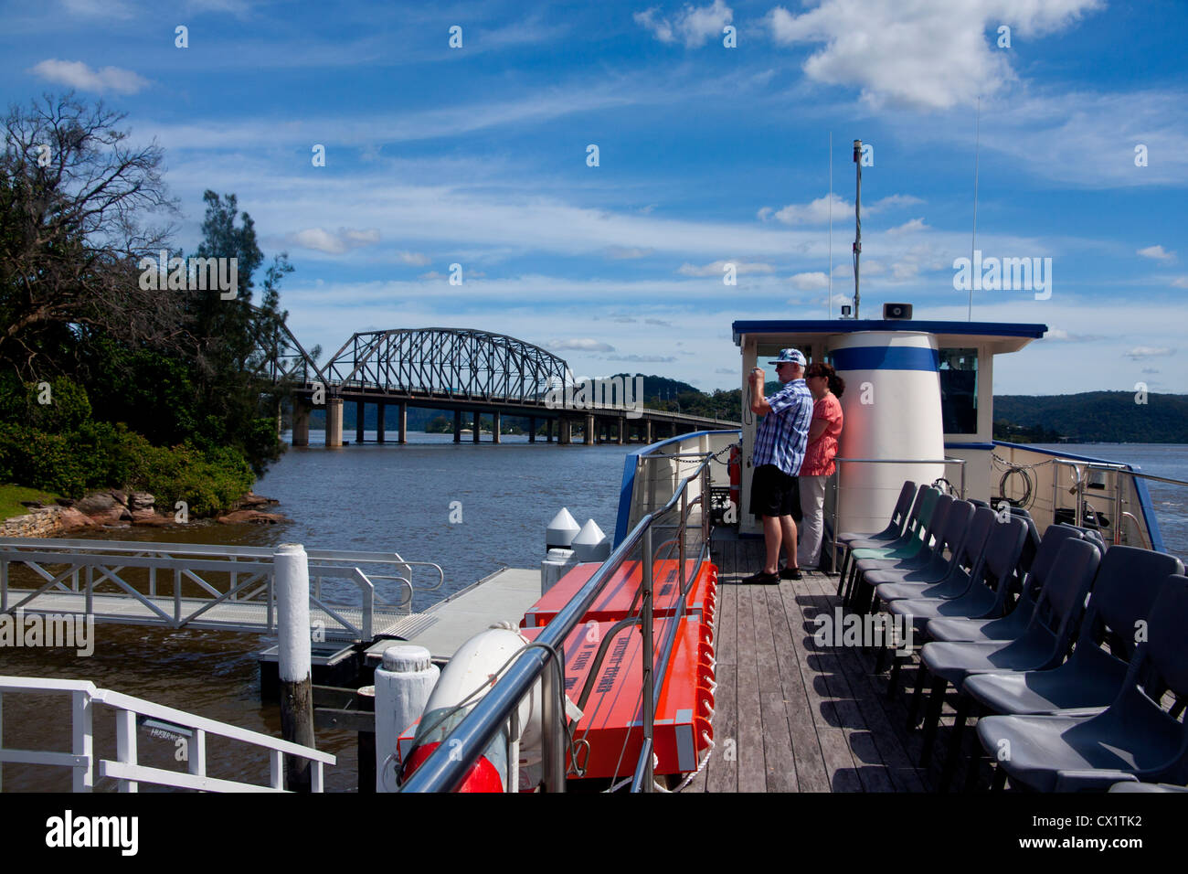 Boat trip on the Hawkesbury Riverboat Postman, with family looking at scenery New South Wales (NSW) Australia Stock Photo
