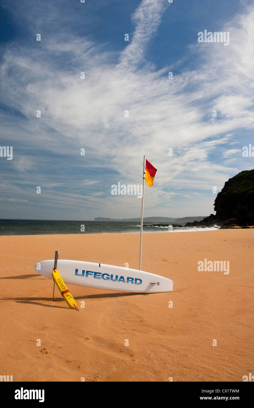Lifeguard flag and surfboard on beach Killcare Beach Central Coast New South Wales (NSW) Australia Stock Photo