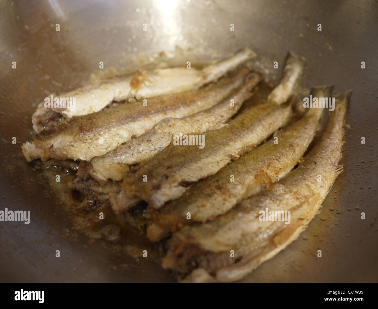 cooking frying deep fried fish wok Stock Photo Alamy