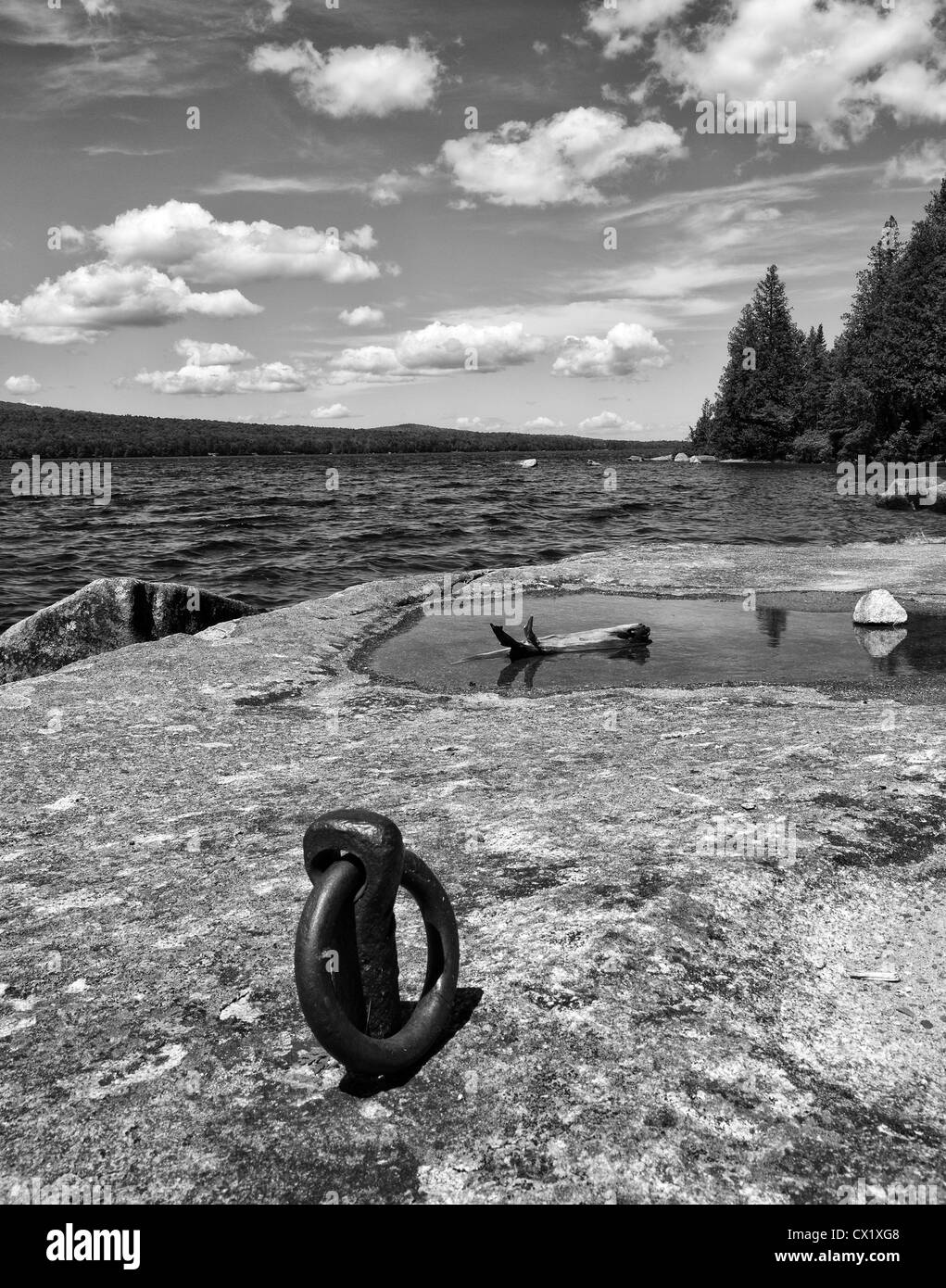 Flat rock and old boat cleat Lake Avril, Vermont,USA Stock Photo