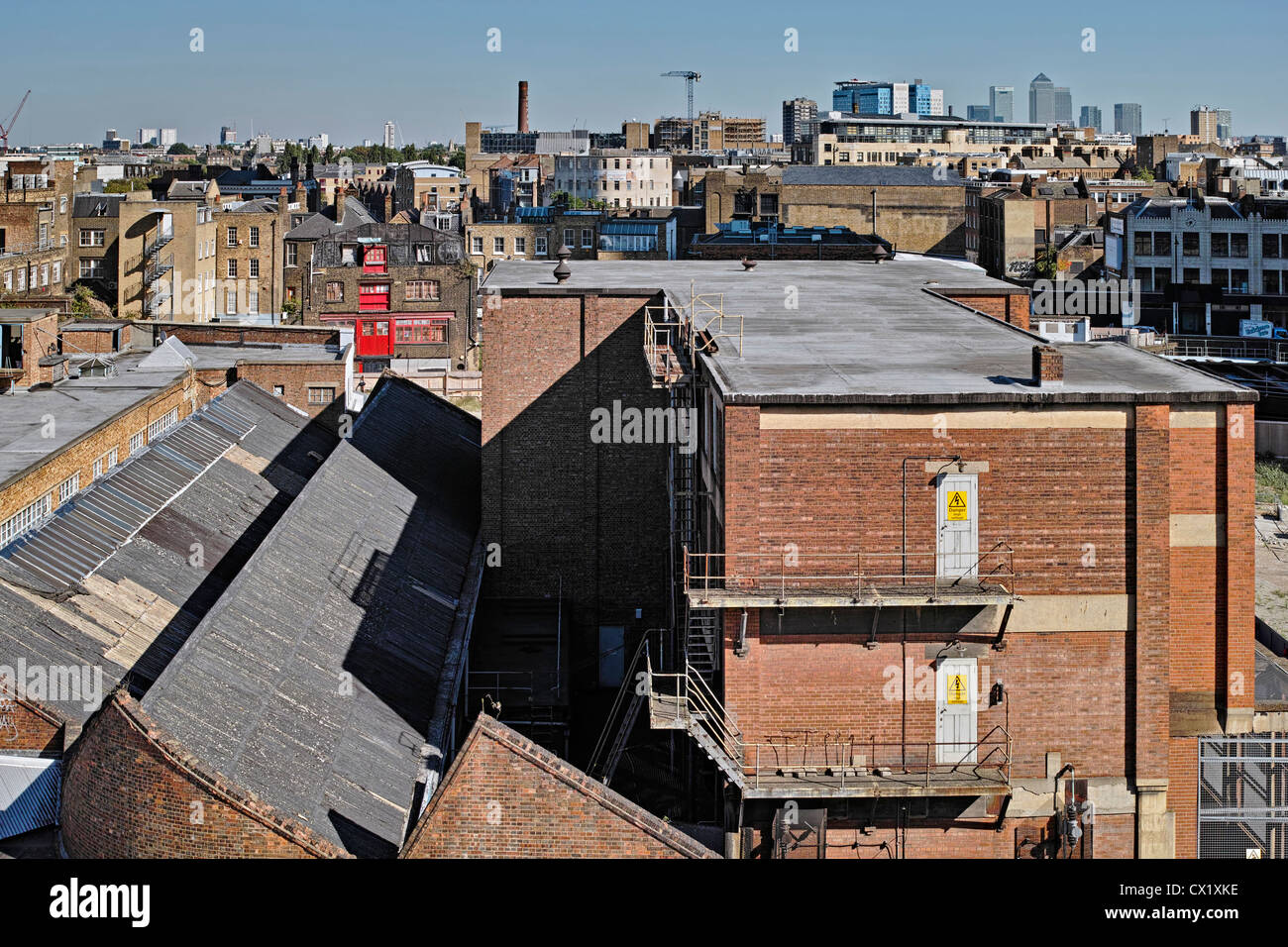 East London Rooftops with Canary Wharf in distance Stock Photo