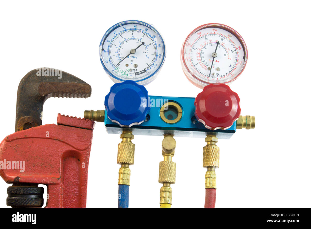 air conditioning manifold with high and low pressure gauges and valves commonly used in HVAC maintenance Stock Photo