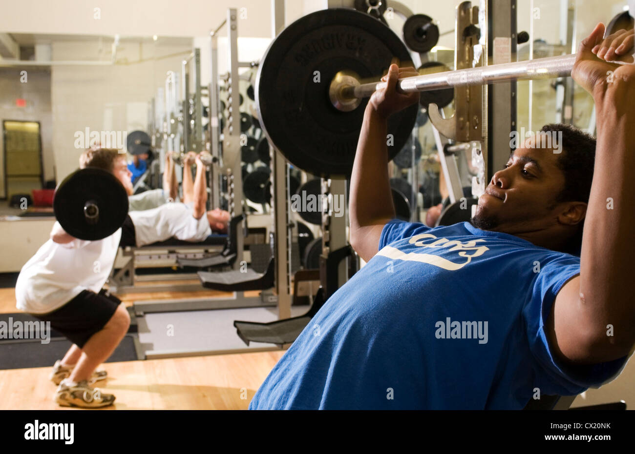 College students train in weight room. Stock Photo