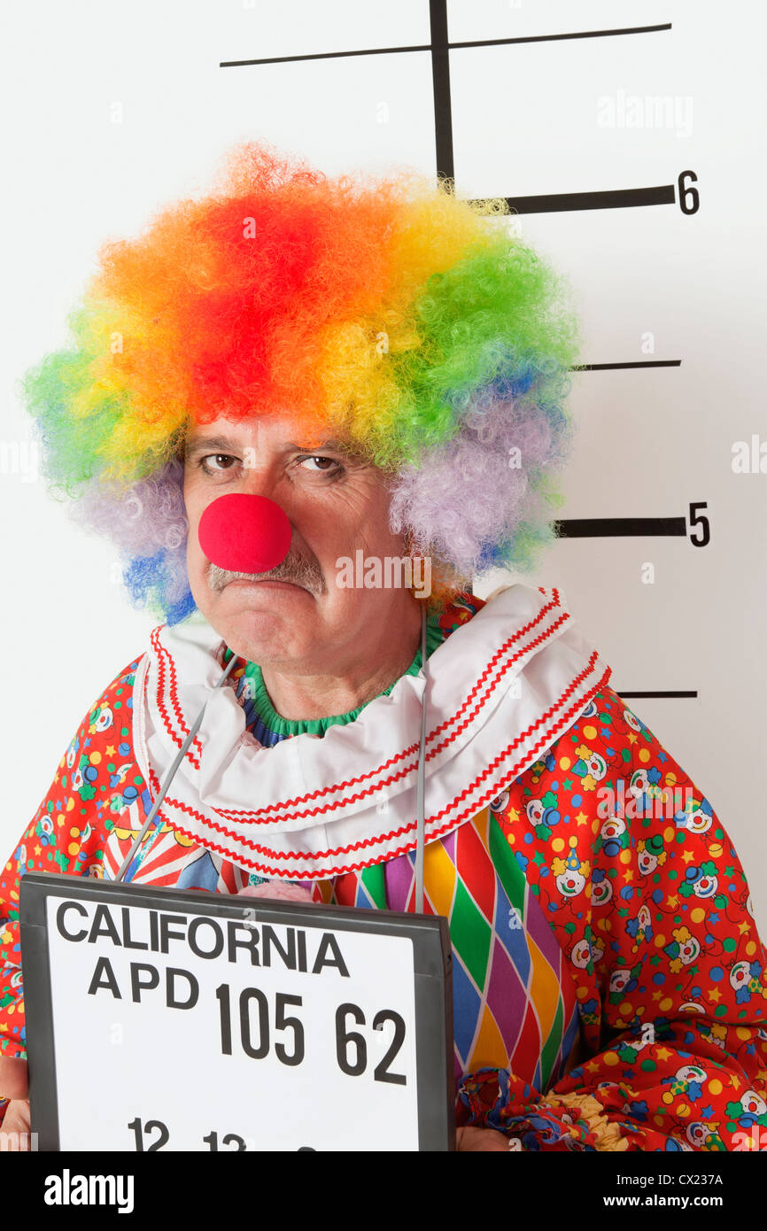 Portrait of angry senior clown during mug shot Stock Photo