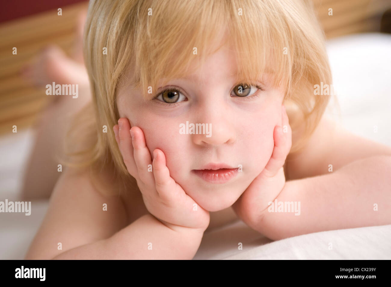 A pretty young Caucasian girl looking into camera Stock Photo