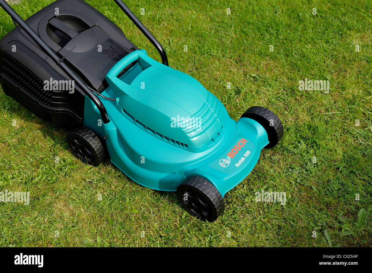 bosch rotak 320 electric rotary lawnmower Stock Photo - Alamy