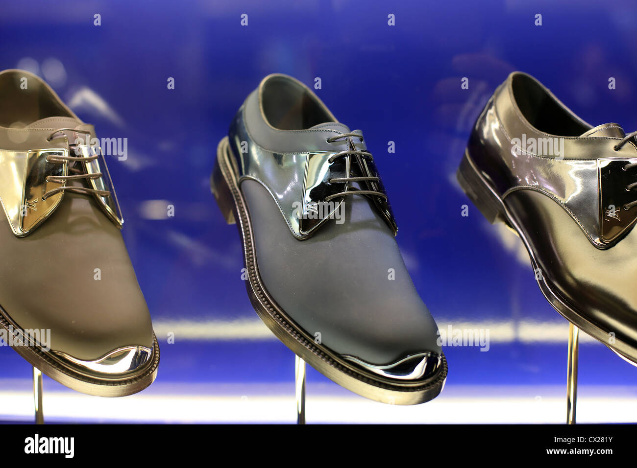 Louis Vuitton mens luxury designer label footwear on display at a boutique in Singapore. Stock Photo