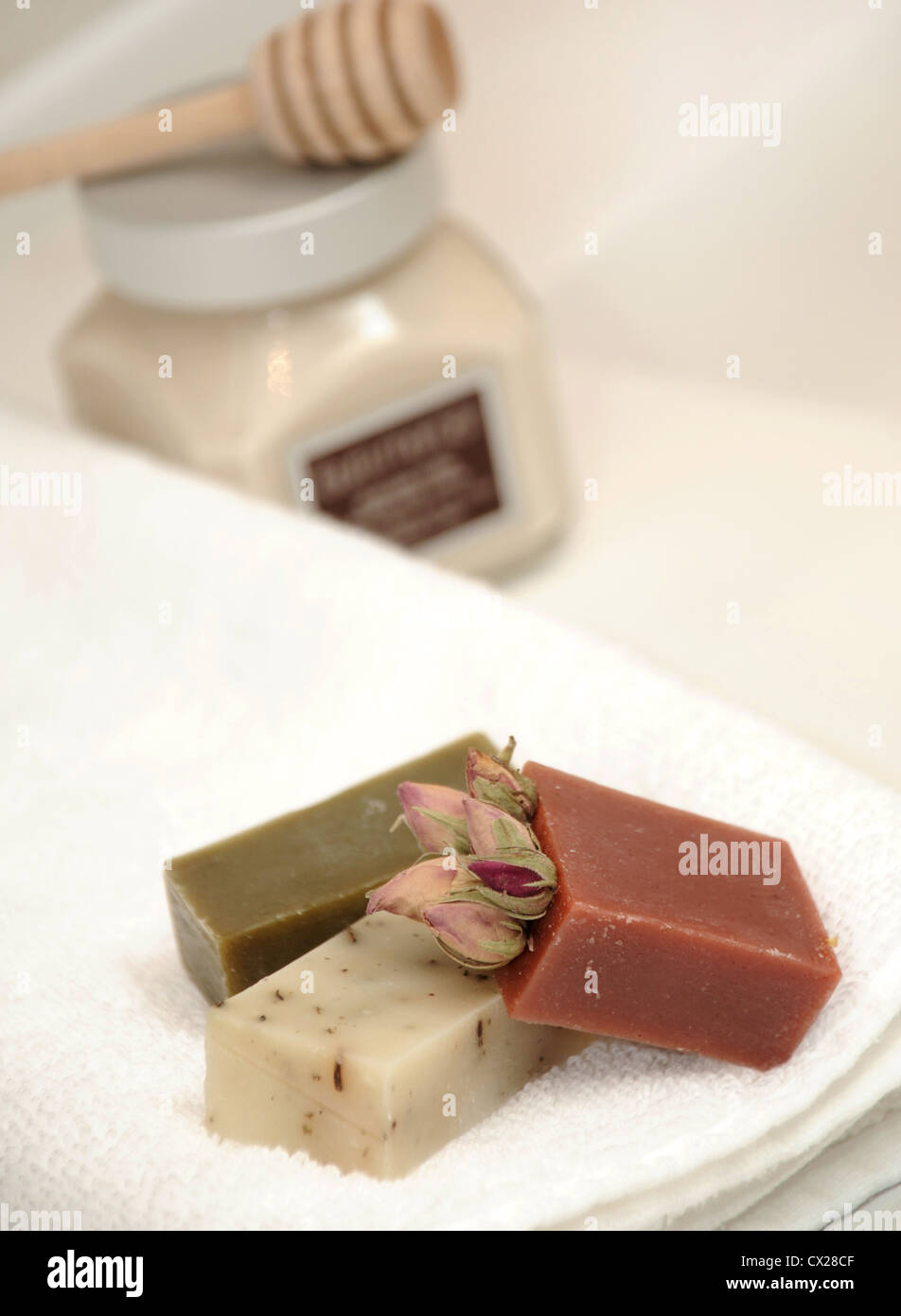 Selectively focused close up of fine hand made soaps on towl in bathroom Stock Photo