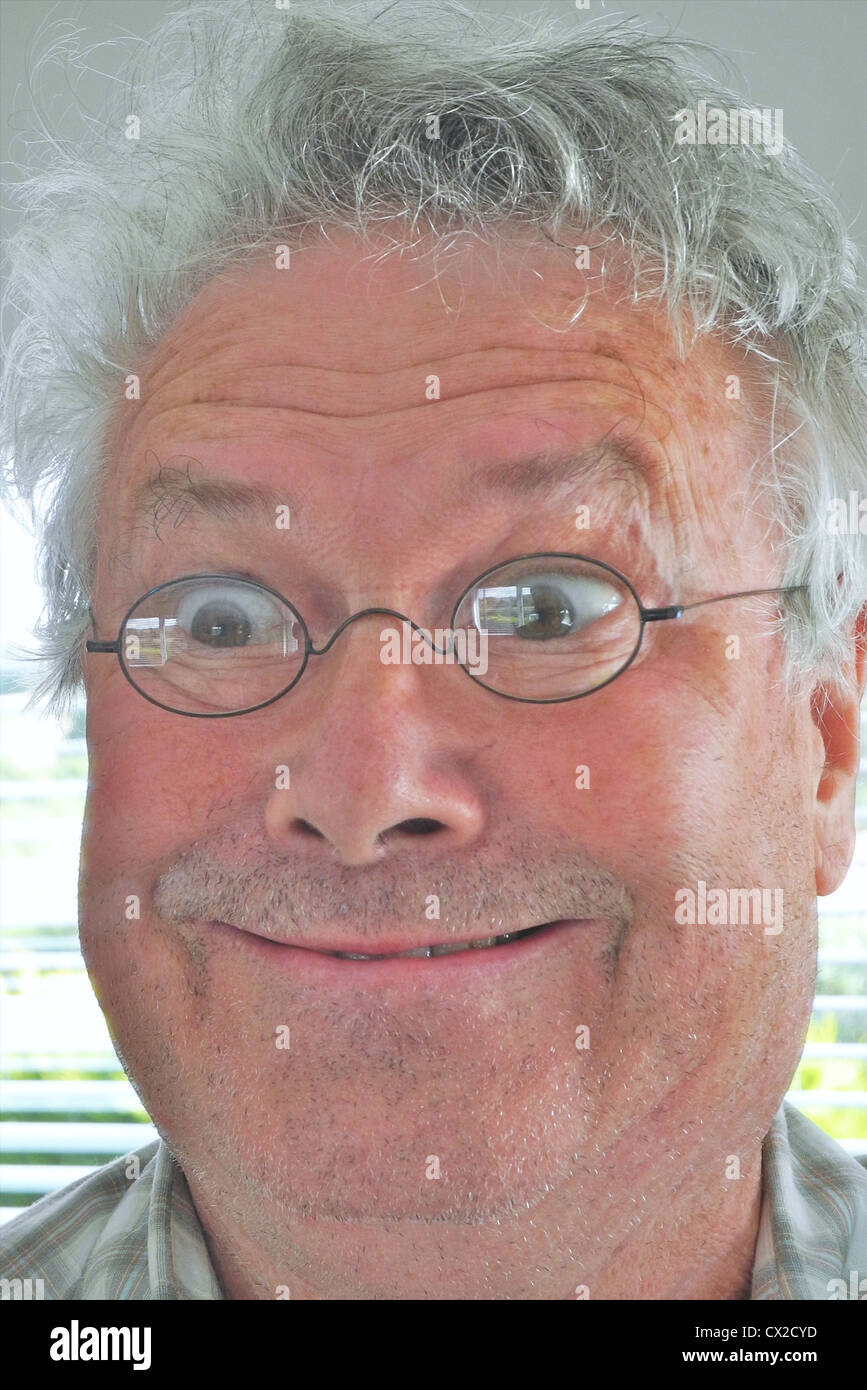 Mad looking old man in glasses -FULLY MODEL RELEASED FOR ANY USE Stock Photo