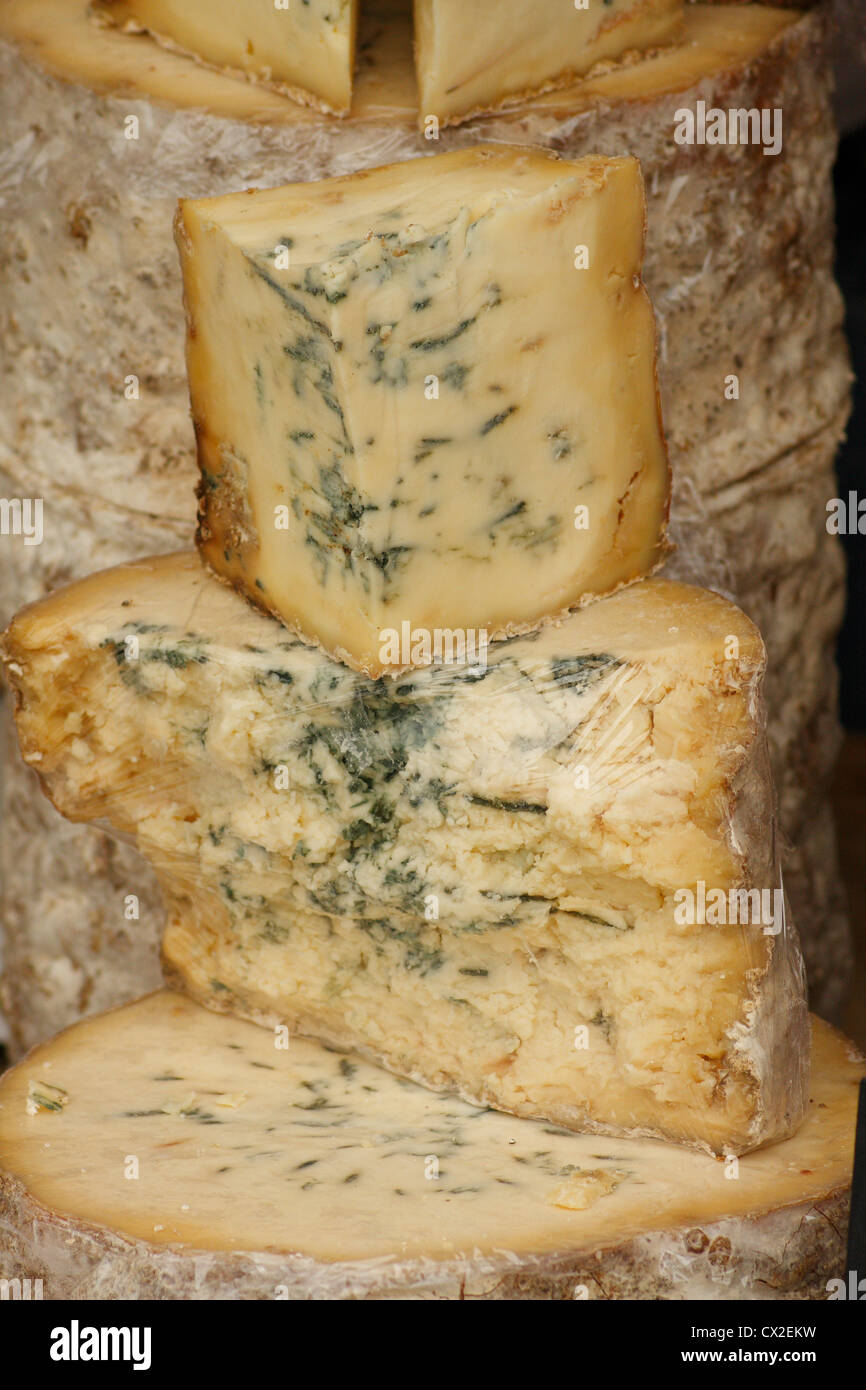 Pile/quarters of blue cheeses with rinds Stock Photo