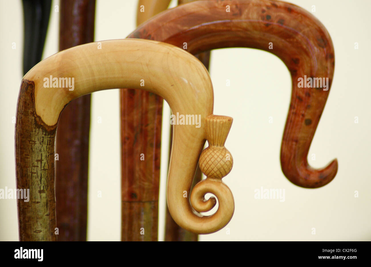 Wood carved handles of walking canes Stock Photo