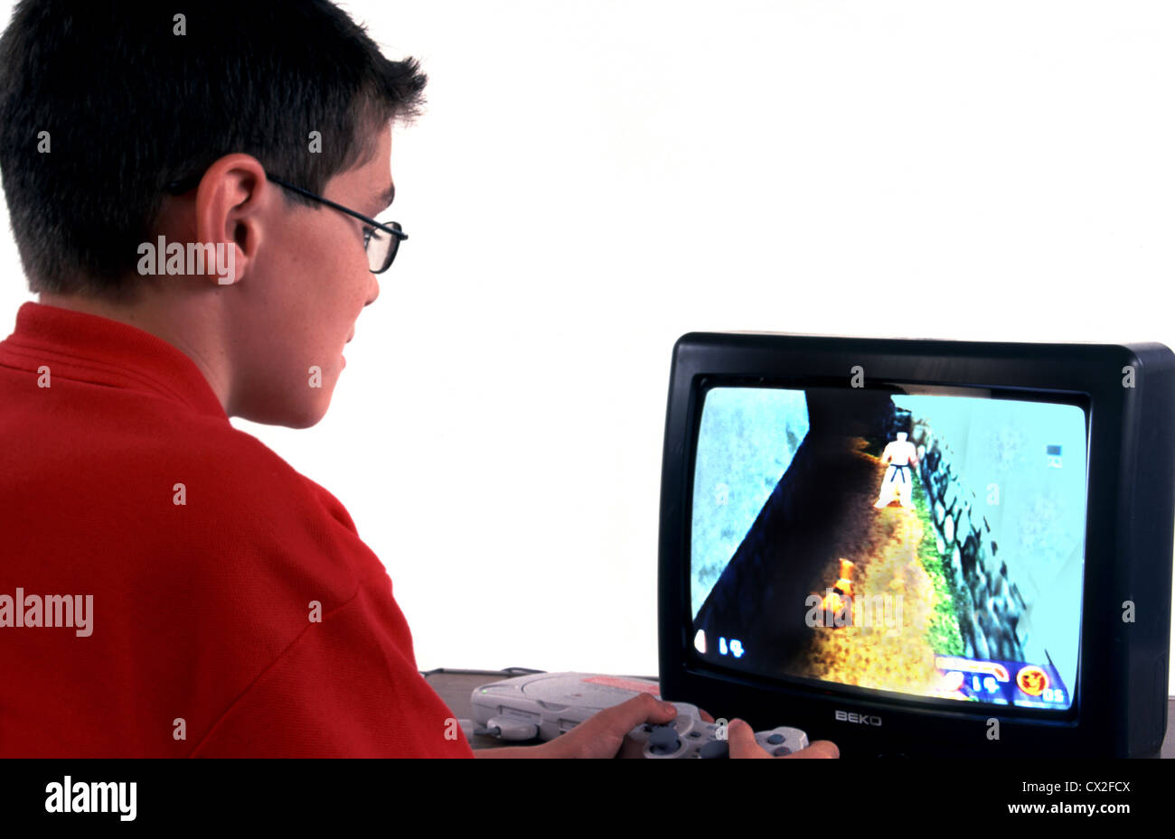 Boy using computer game, UK Stock Photo - Alamy