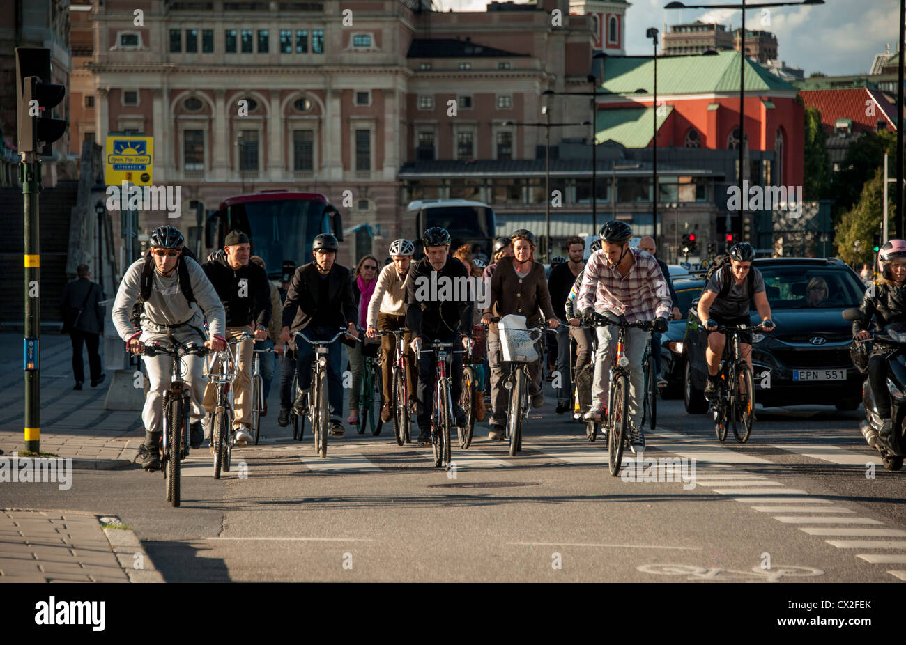 Commuters on bicycles passing Gamla Stan Old Town in Stockholm Sweden Stock Photo
