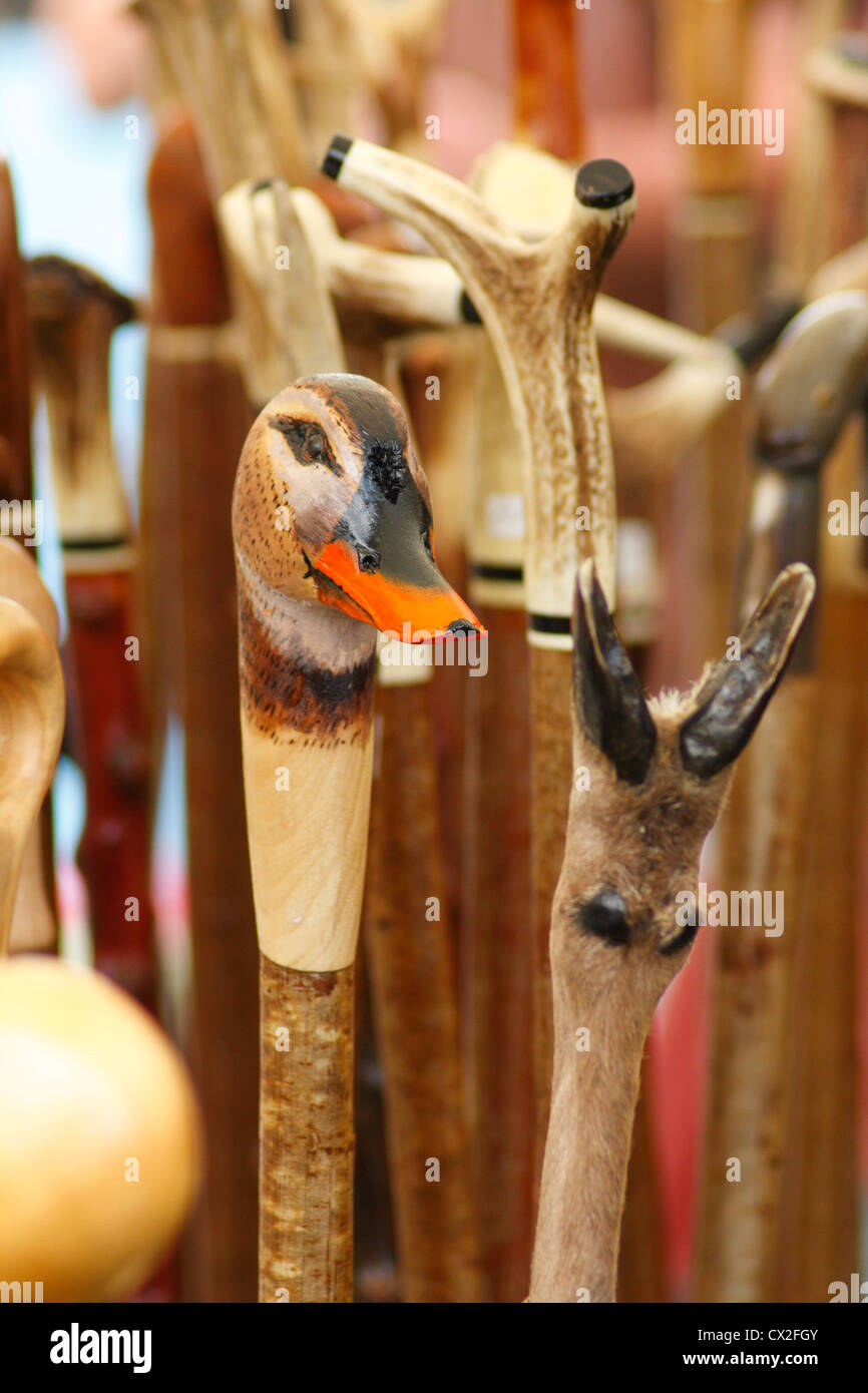 Wooden walking sticks shaped as duck head for sale Stock Photo
