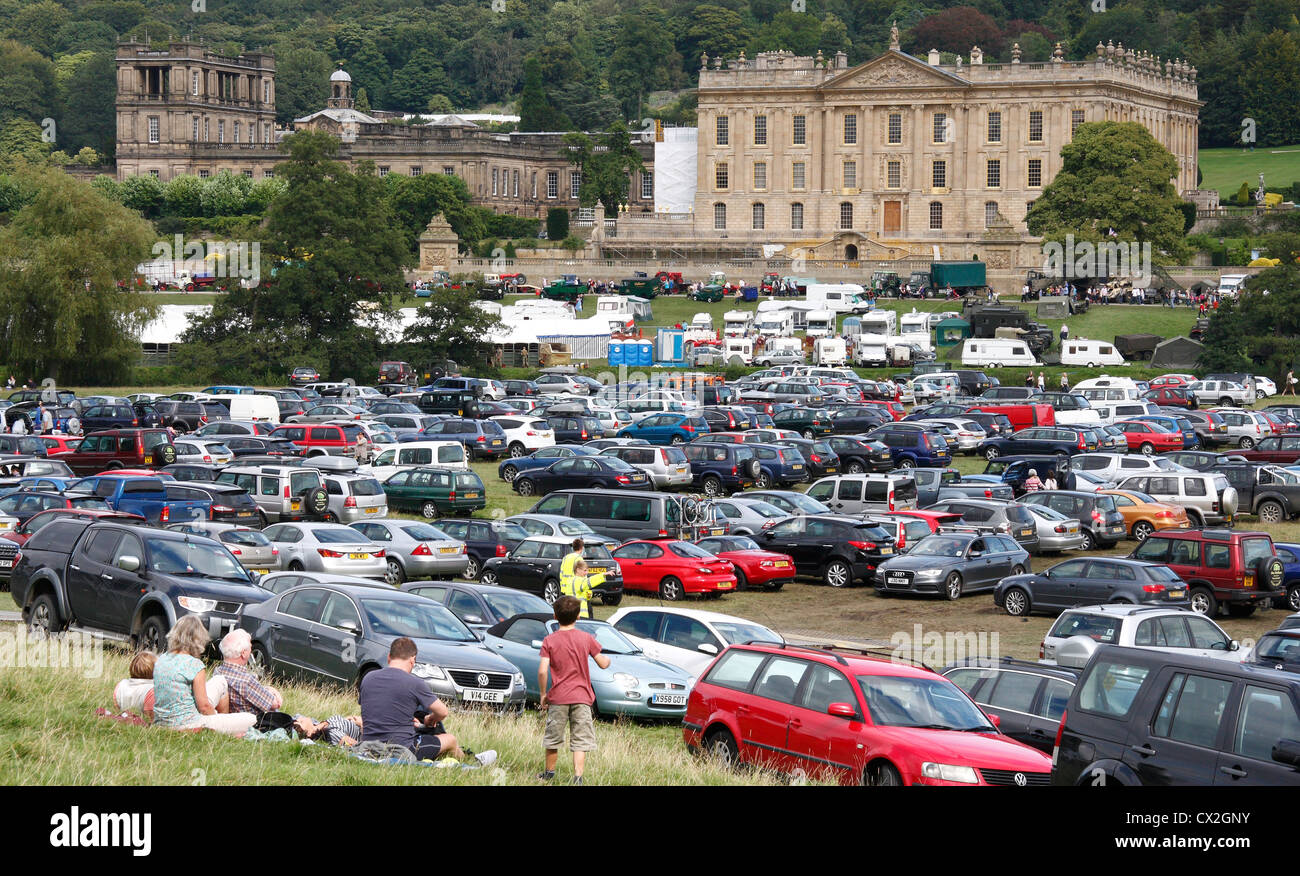A family picnic against backdrop of Chatsworth House on a busy day at Chatsworth Country Fair 2012, Derbyshire, UK Stock Photo