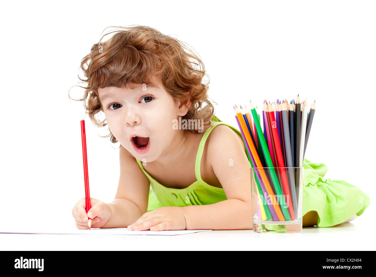 Little emotional girl with green pencil and big copyspace isolated Stock Photo