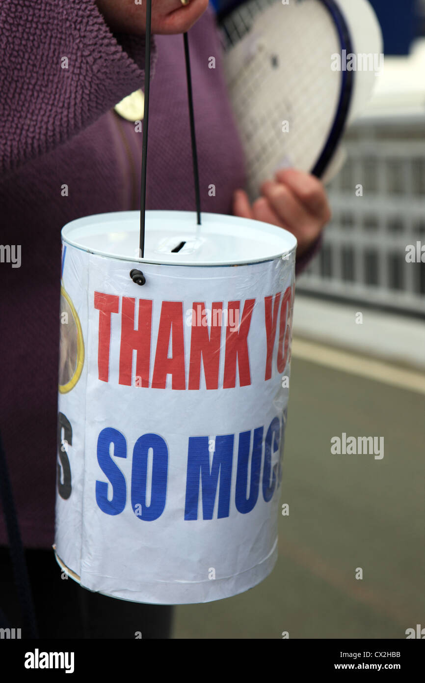 Charity collecting tin with the words thank you so much written on it Stock Photo