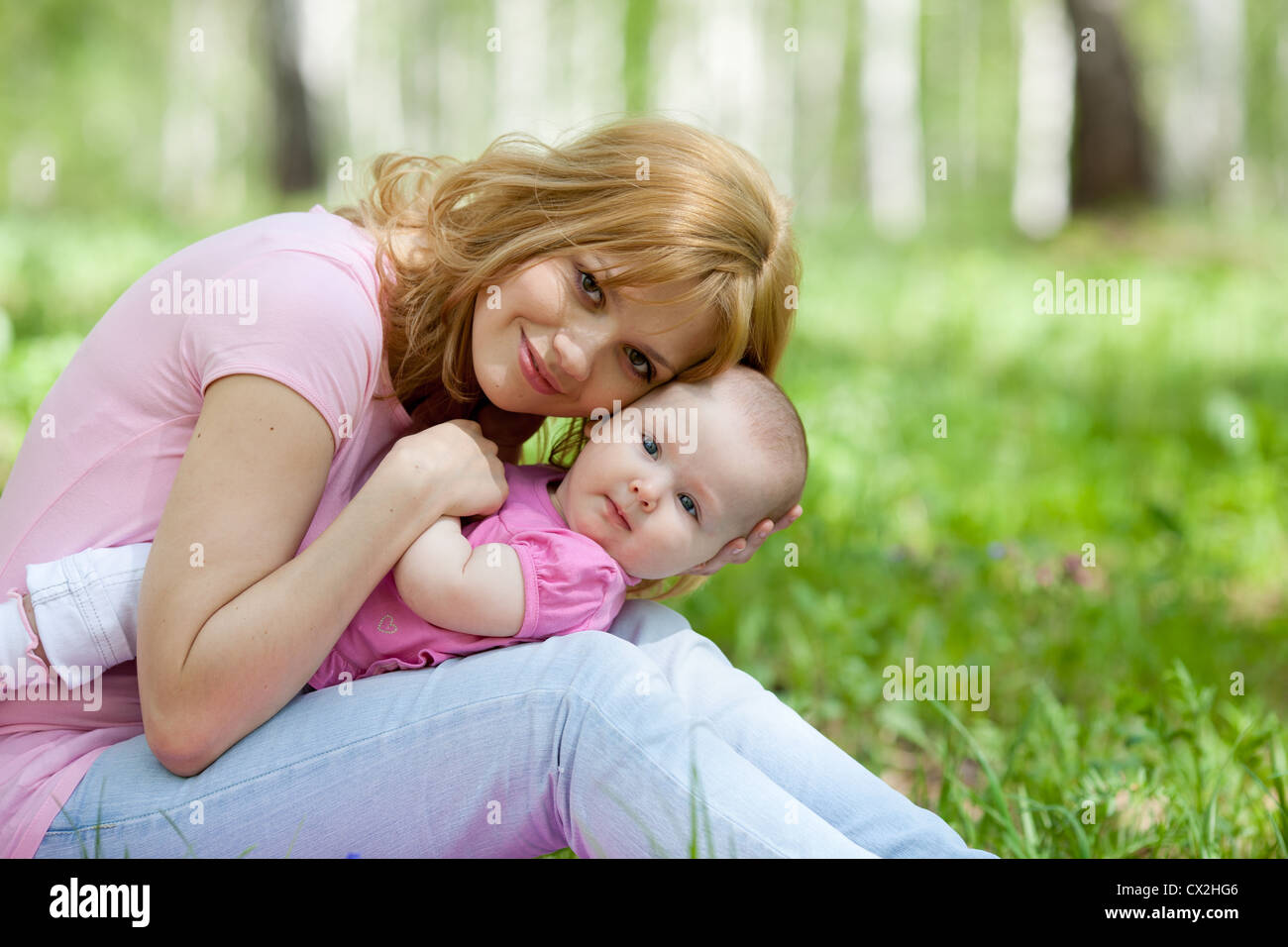 Mother and daughter in birch spring park Stock Photo