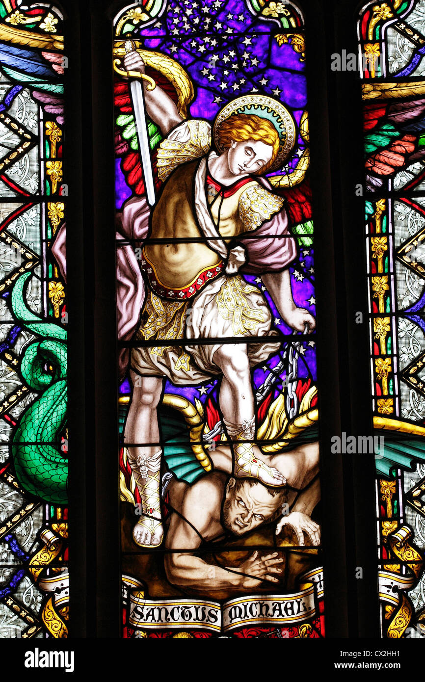 A stained glass window depicting St Michael in the Parish Church at