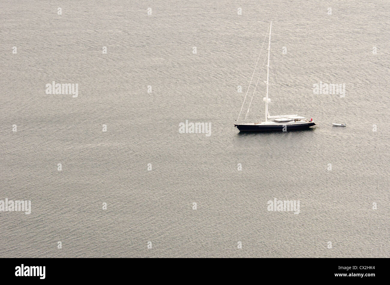 The sailing yacht Genevieve sits at anchor off the island of Bartolome