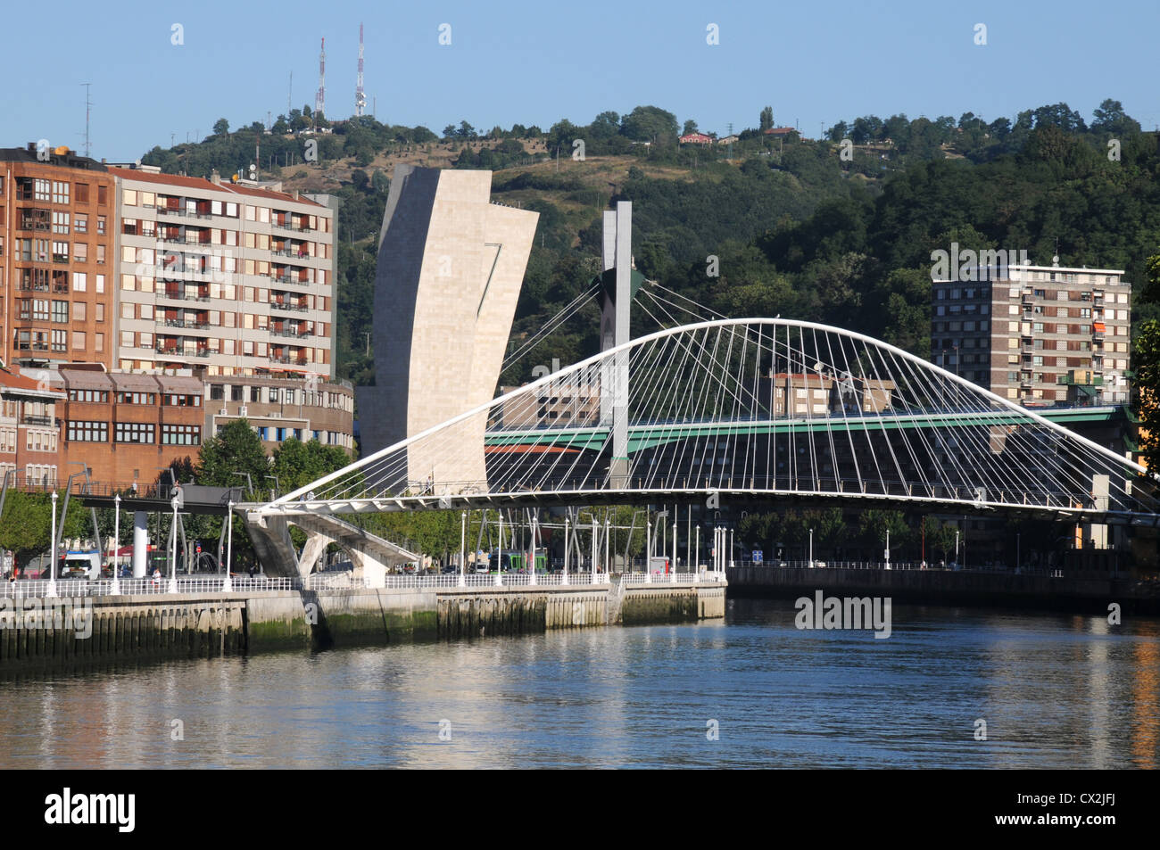 Zubizuri Bridge, a pedestrian crossing over the Nervion River, Bilbao, Spain Stock Photo
