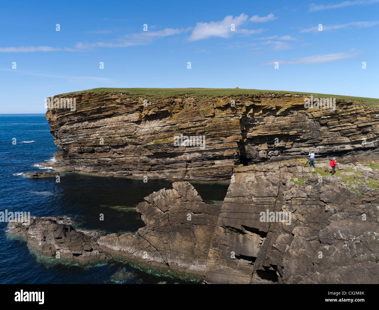 dh Brough of Bigging YESNABY ORKNEY Tourist family on seacliff tops blue sky sea cliffs holiday tourists scotland summer outdoors Stock Photo