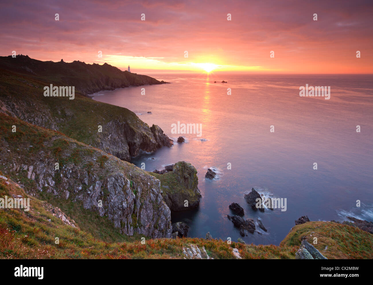 Spectacular sunrise behind Start Point Lighthouse in South Hams, Devon, England. Autumn (September) 2010 Stock Photo