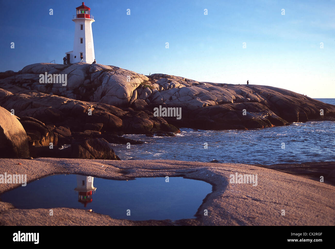 Peggy's Point Lighthouse reflected in rock pool. Nova Scotia Stock Photo
