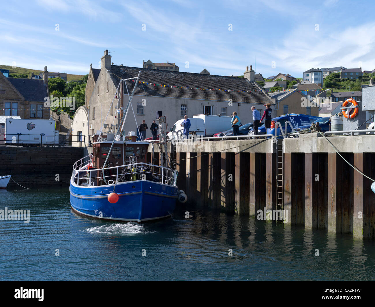 dh  STROMNESS ORKNEY Diving vessel berthing Stromness harbour pier boat Stock Photo